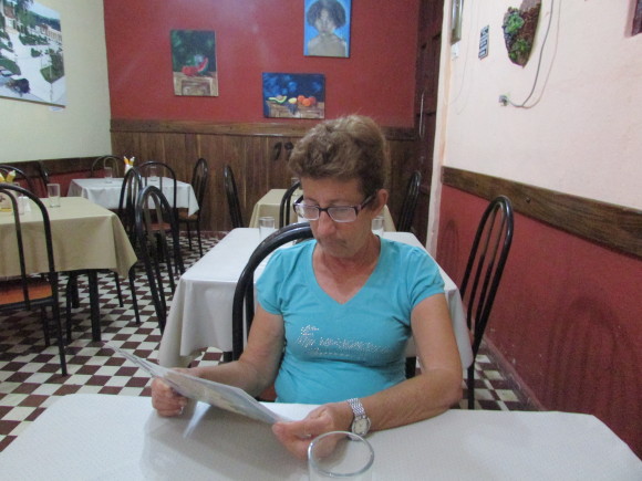 My aunt choosing her food from the menu at "1900's Restaurant"