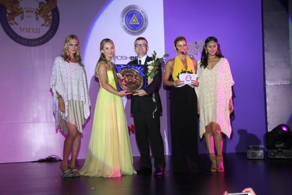 Mrs Nicola El-Mouelhy-VP SSLHLA , Ms Ece Vahapoglu presenting an award on stage at The Seven Stars Luxury Hospitality And Lifestyle Awards in Bali 2015